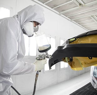 Collision Center Technician Painting a Vehicle | Dan Hecht Toyota in Effingham IL
